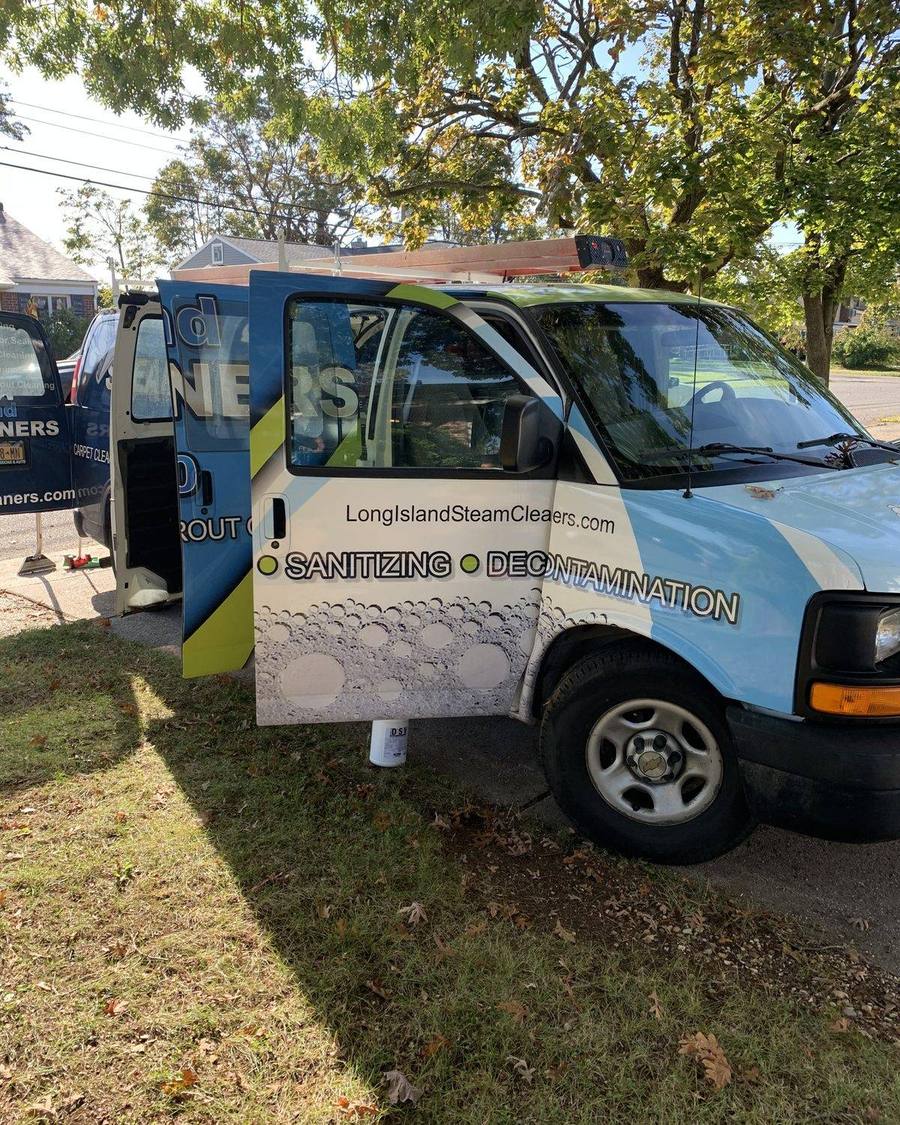 Long Island Steam Cleaners van with the truck-mounted rig, wrapped with the services list