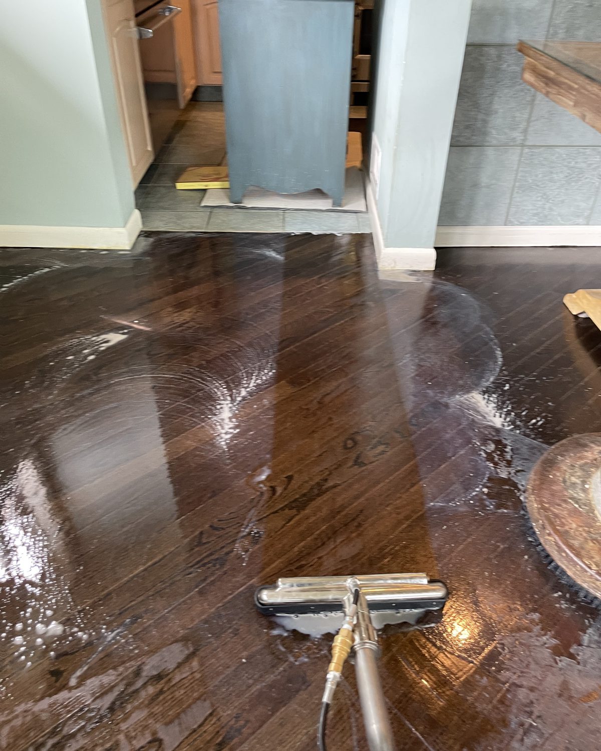 Hardwood floor being deep cleaned